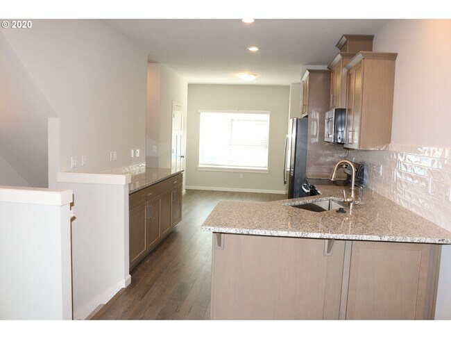 Building Photo - Modern 3-Bedroom Townhome-Style Home with Attached Garage, Private Patio & En-Suite Bathrooms in ...