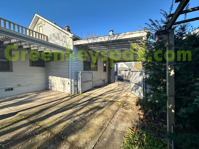 Building Photo - Huge, fenced back yard! Garage! Nice bonus...