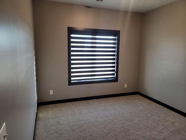 Building Photo - Three bedroom two bathroom triple garage house