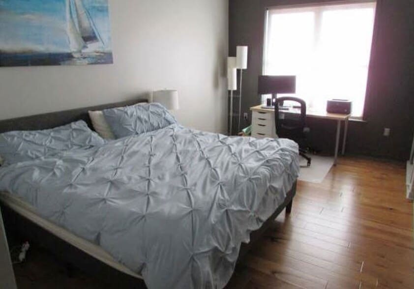 Large master bedroom suite with door to the patio and large closet and bath and laundry attached - 360 W Washington Ave