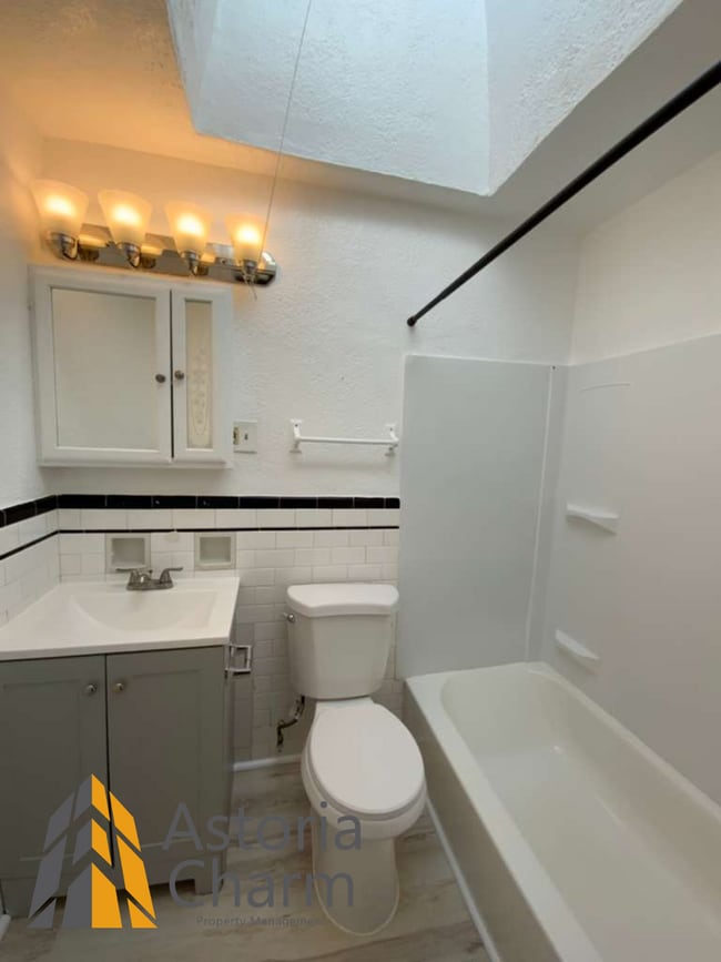 Building Photo - 3 Bed with Finished Basement, Skylight Bath, and Private Yard
