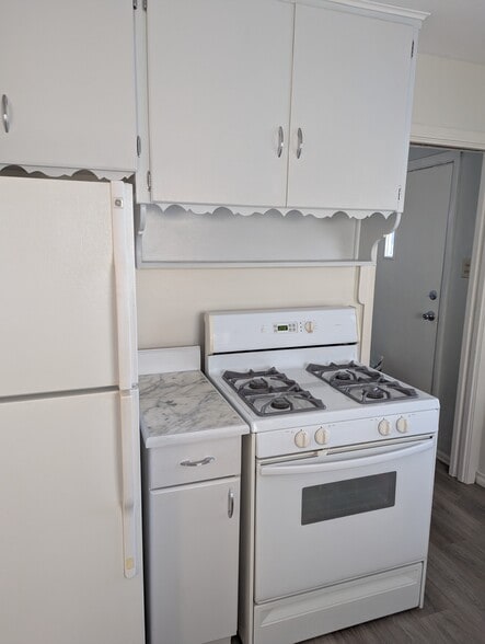 A pocket door leads to laundry room and back door - 119 Farragut Ave