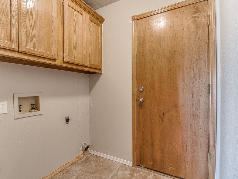 Laundry room with garage entry - 1821 Overland Trail