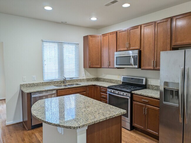 Building Photo - Brambleton Elegance: A Spacious Townhome Oasis