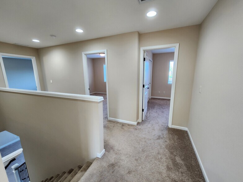 Primary Bedroom and Other Two Bedrooms on Second Floor - 6128 NW Trowbridge Dr