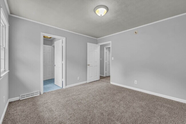 Building Photo - spacious 4-bedroom, 2.5-bath home featuring a 2-car garage and fresh updates throughout.