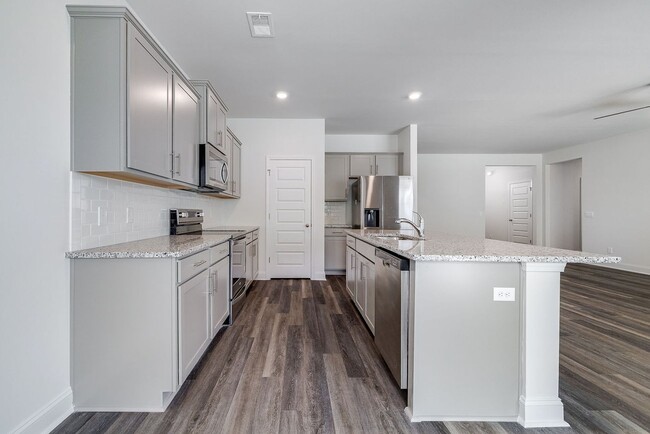Building Photo - Beautiful 4BR Home in Woodland Trail – Top...