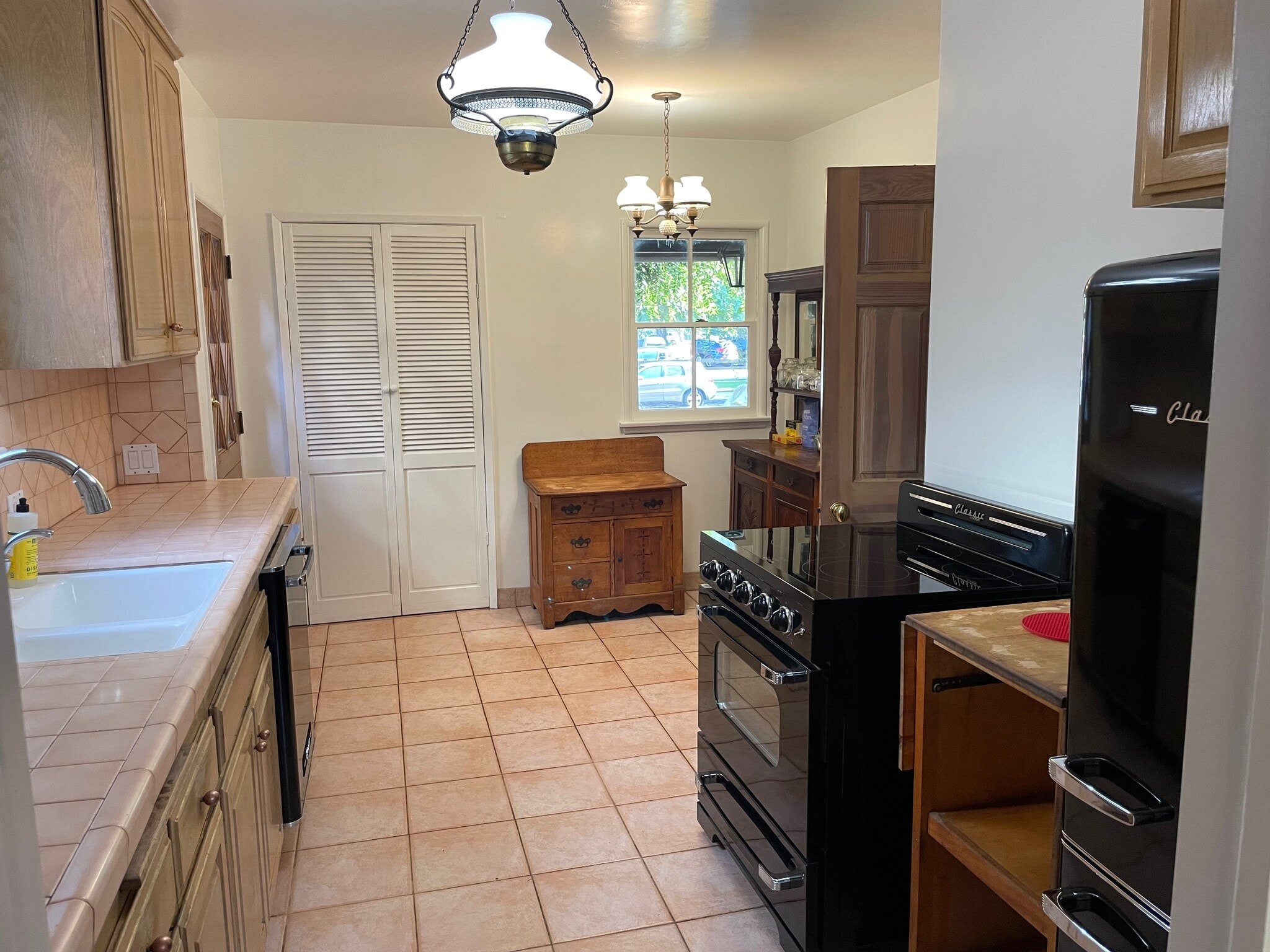 The kitchen has vintage style but modern appliances - 11449 Woodbine St