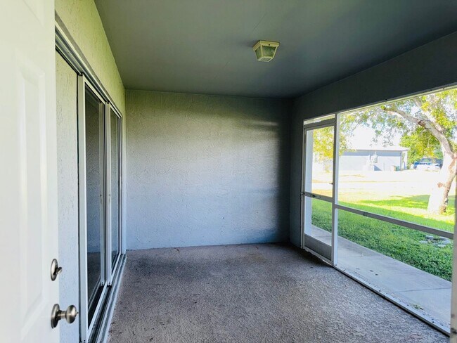 Building Photo - Experience this Cape Coral 3 bedroom 2 bath corner duplex with 1 car garage and screened in lanai.