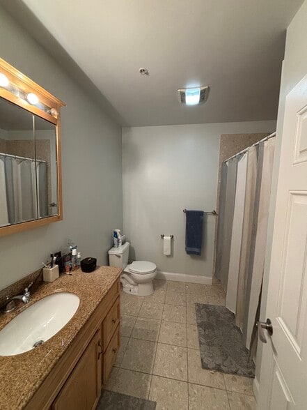 Updated shared bathroom with 1 person - 1328 Broadway