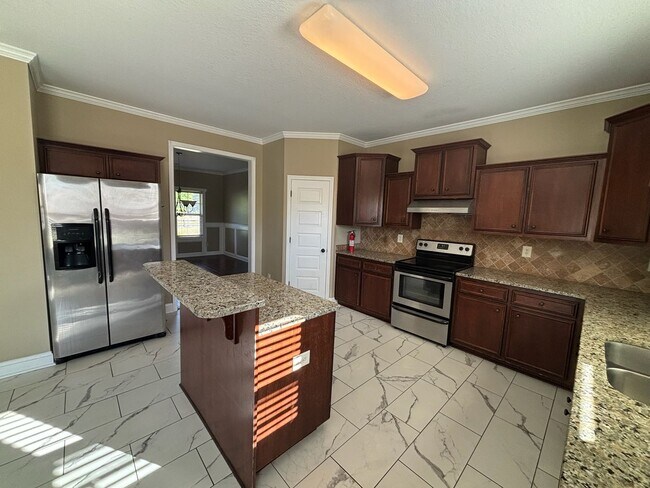 Building Photo - This property blends ample living space and storage with functional amenities.
