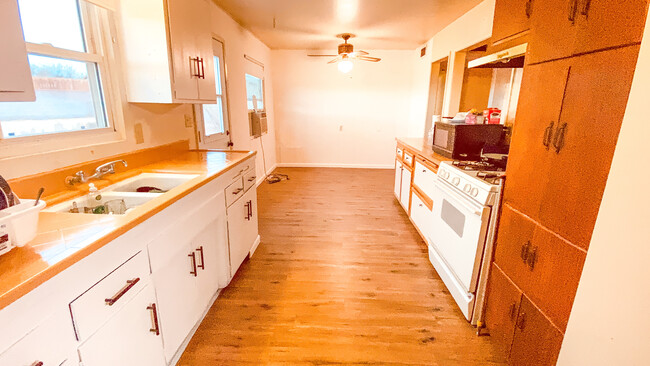 Large galley style kitchen with dining room - 15875 Lawrence Dr