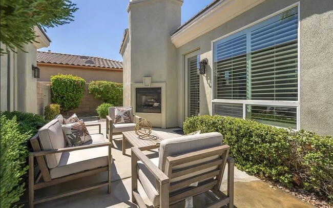 Outdoor courtyard with fireplace - 36110 Da Vinci Dr