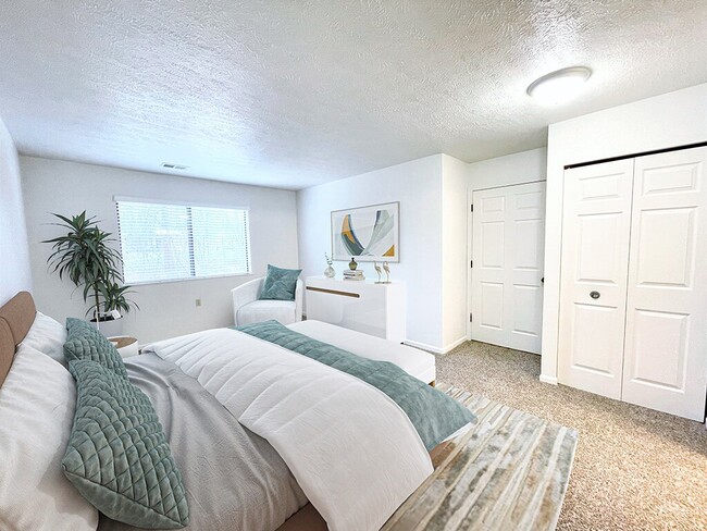 Large Carpeted Bedroom with Overhead Light - Huntington Glen