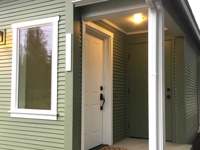 Storage outside the front door accommodates bikes and seasonal adventure gear. - 9235 SW 7th Ave