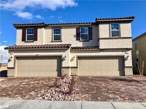 Building Photo - Beautiful Townhome in a Gated Community with 2-Car Garage!!