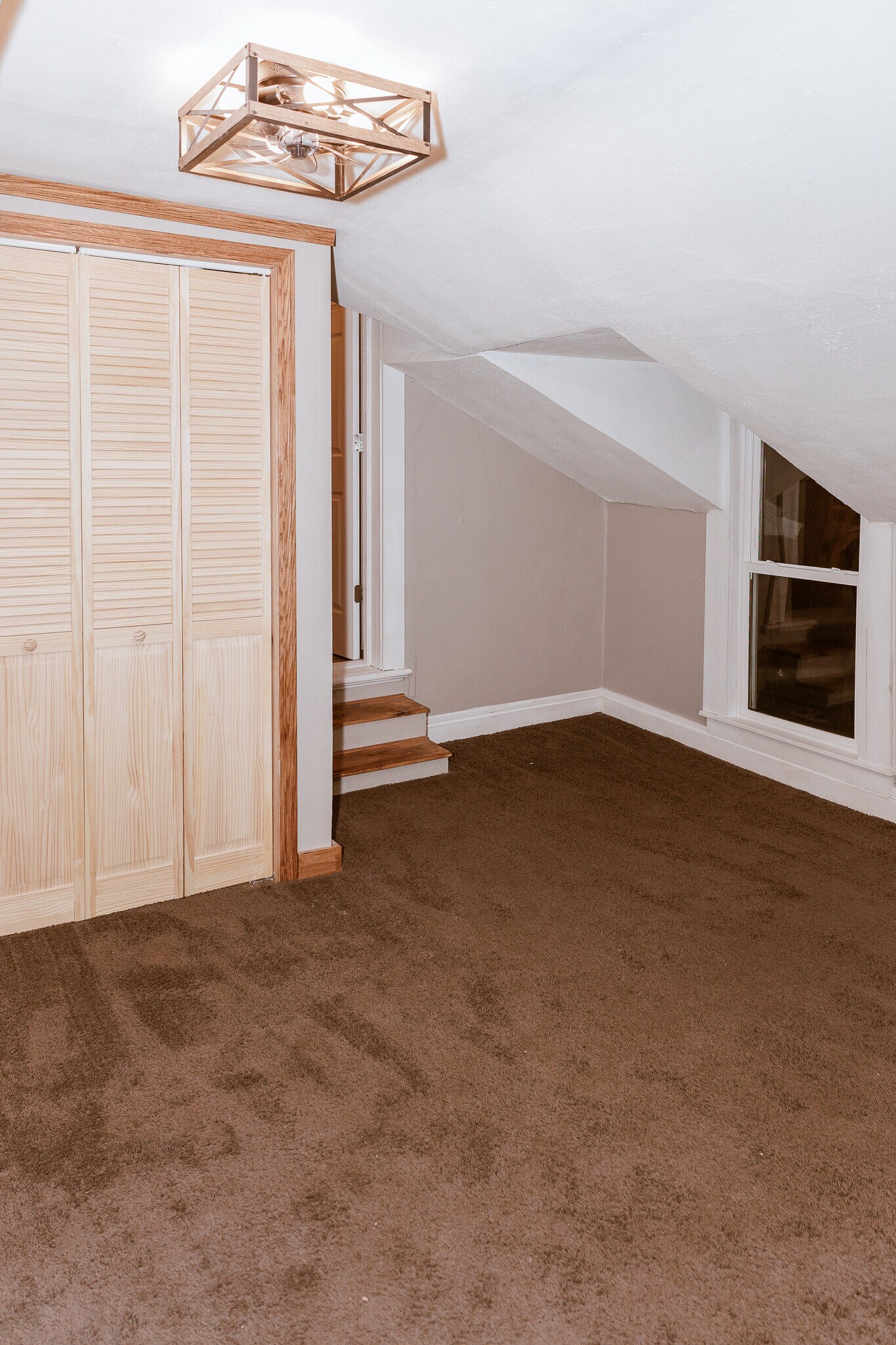 Living room with entry to Bedroom 1 - 327 S Adams St