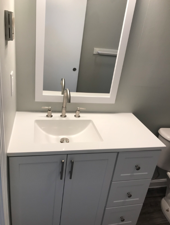 Updated vanity, mirror and lighting - 252 Union St