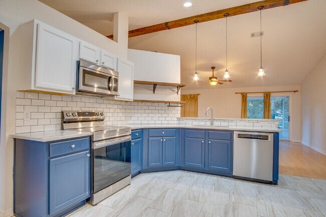 Building Photo - Energy-Efficient 3BR/2BA Solar Home in Pace with Screened Porch, Fenced Backyard, Updated Kitchen...