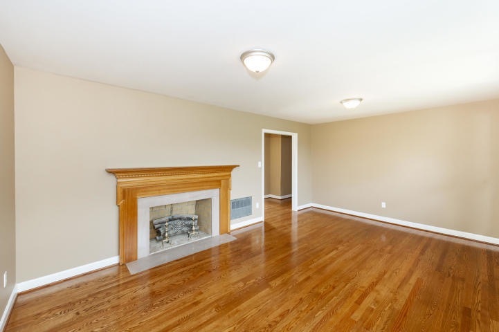 Family room (available furnished with a large couch and recliner) - 6917 Cresthill Dr