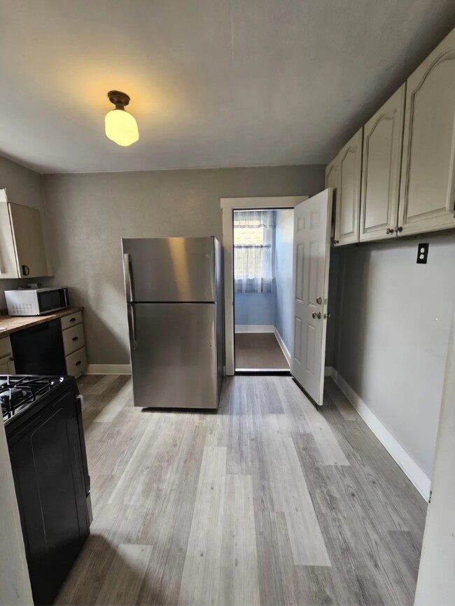 Kitchen with back door entrance - 2115 Lloyd Ave