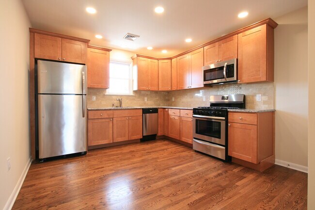 Kitchen with granite countertops and stainless appliances - 420 W Cypress St