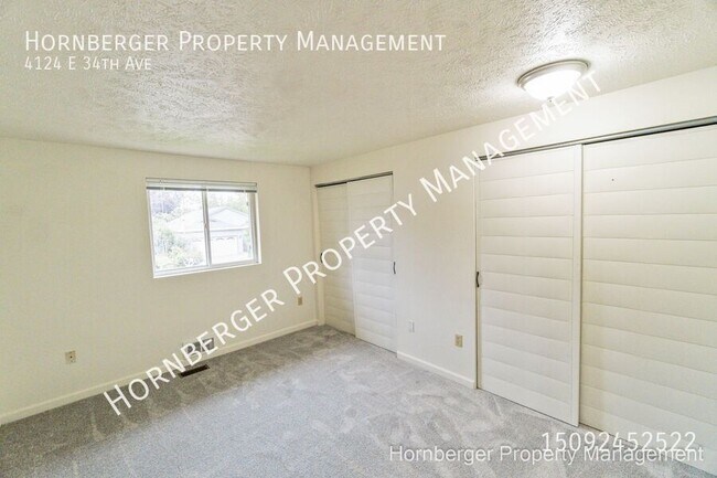 Building Photo - 4124 E 34th Ave