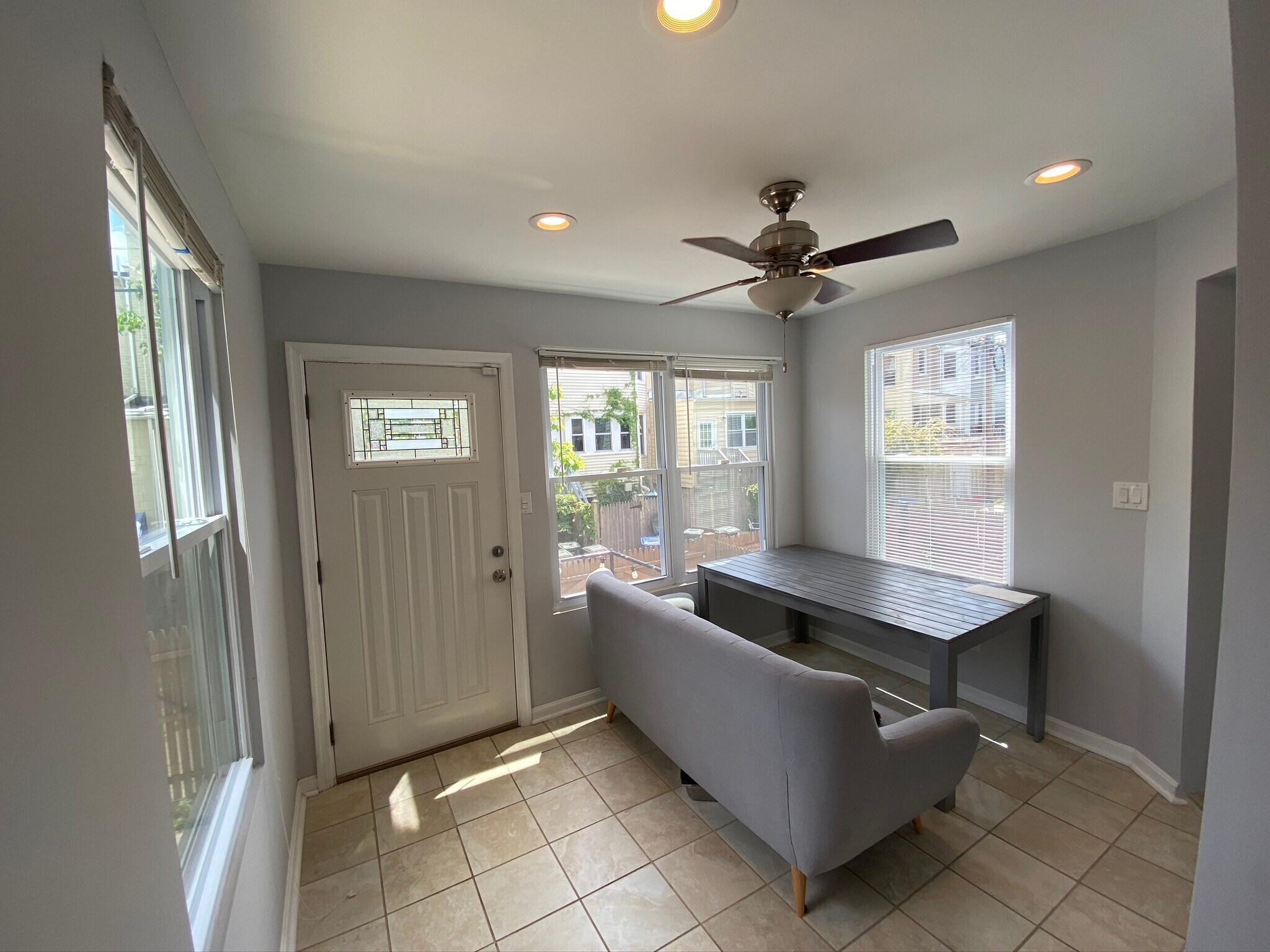 Sunroom/dining room with door to backyard - 616 Lamont St NW