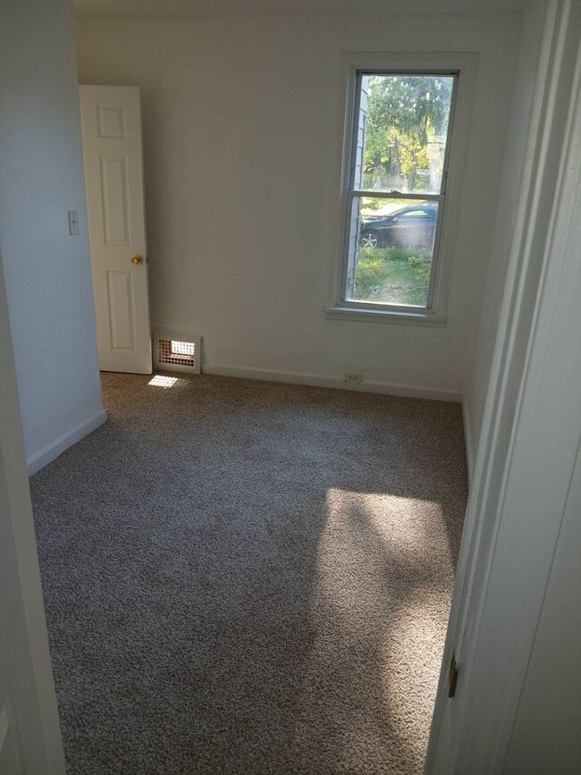 Building Photo - Newly Renovated 4BR/1BA Single-Family Home with Garage – Cleveland