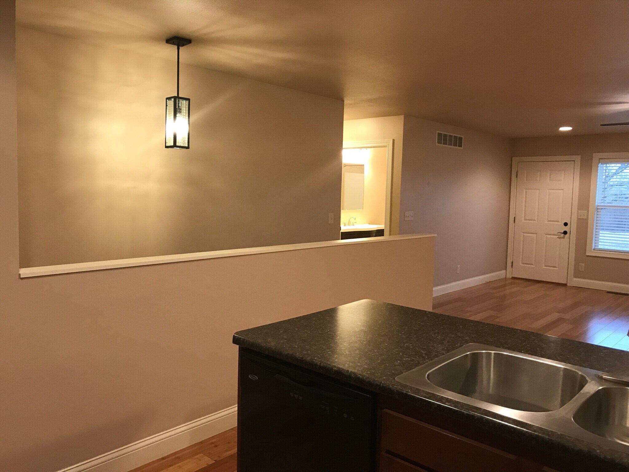 Stairway to basement and hallway to bedrooms off main room. - 206 Stallion Way