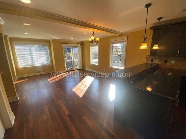 Building Photo - Spacious townhome with private backyard, garage parking, multiple decks, and a dedicated home off...