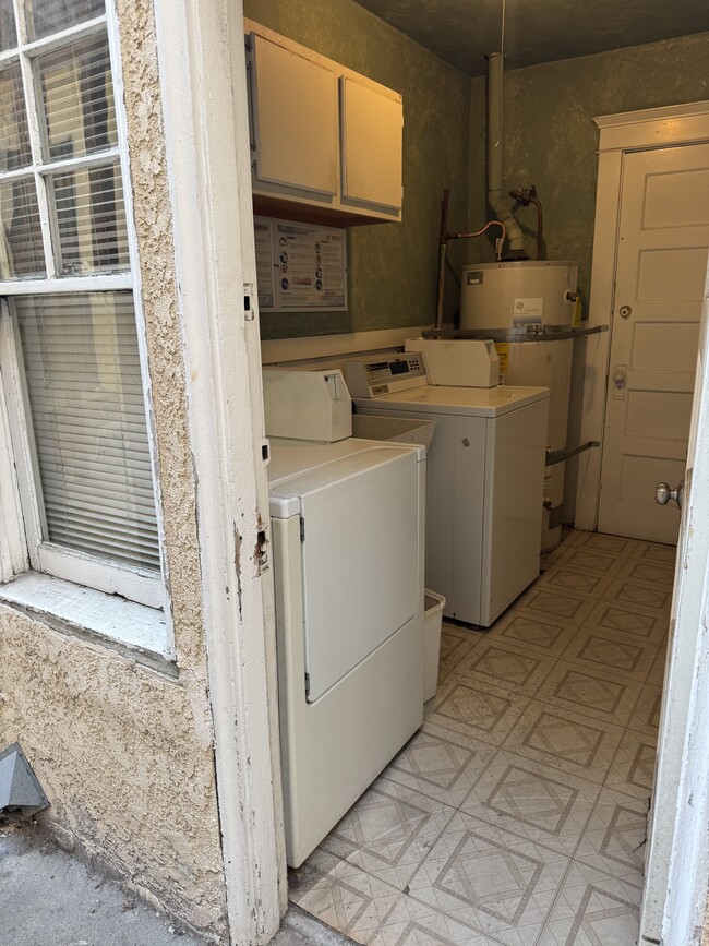 Laundry room in the garage building directly behind the triplex building. - 1749 E 3rd St