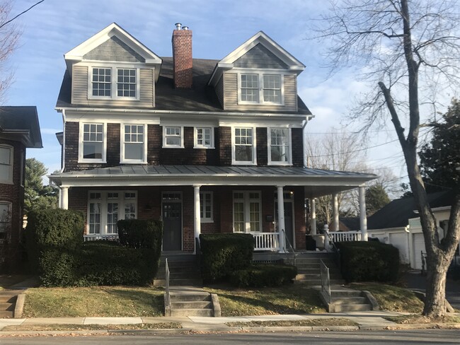 Street view showing the large shared front porch - 404 Elm St