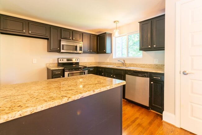 Building Photo - **Application pending 5/1/2026**Stunning Carrboro Condo available early June!