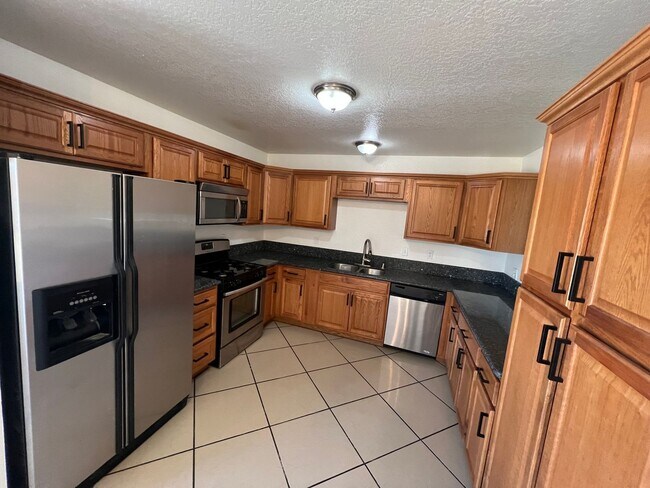 Building Photo - Move-In Ready Beauty with Granite Kitchen, Stainless Steel Appliances & Expansive Backyard