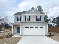 Building Photo - Beautiful 3 Bedroom 2-Car Garage Home w/Lo...