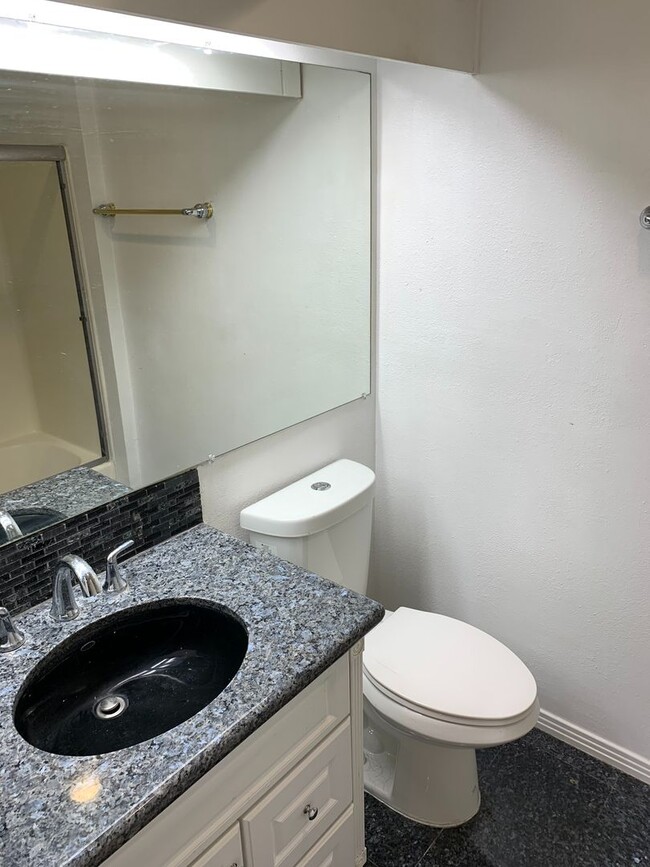 Building Photo - 1st floor 2+2 w/oversized patio, water + t...