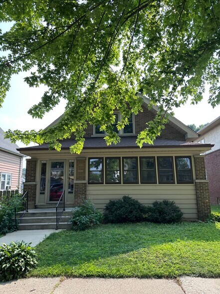 Front of Duplex with sun room fronting the street. - 3466 S Delaware Ave