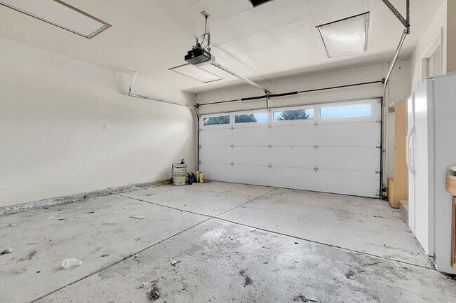 Building Photo - $2,720.95 - 4 bed, 2 bath, located in Aurora with attached Garage and In Unit Washer and Dryer!