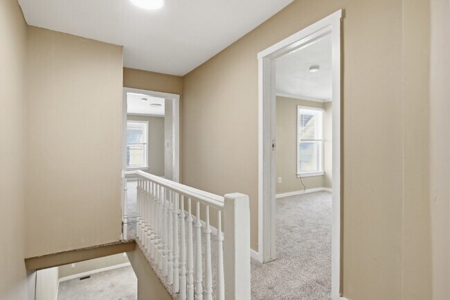 Building Photo - This well-maintained 4-bedroom, 2-bath duplex offers a spacious layout with all the comforts of h...
