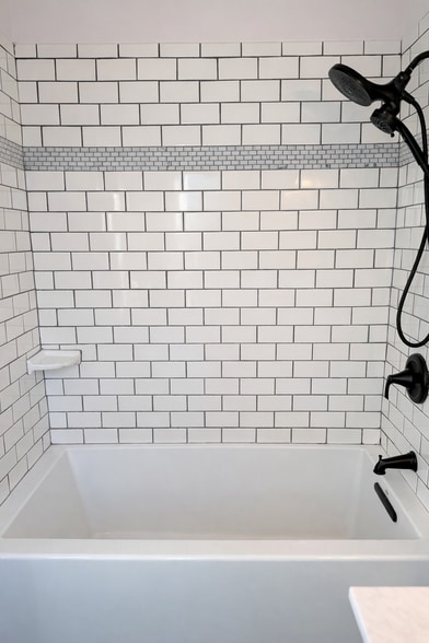 Deep soaking tub, perfect for unwinding after a long day. - 604 NE Shaver St