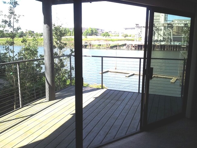 Building Photo - Newly Renovated condo with Stunning River ...