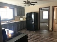 Building Photo - COMING SOON! Cute South County Cottage with White Picket fence, and  Garage