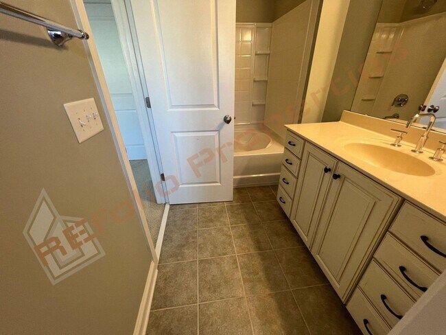 Building Photo - Elegant 3 Story 3 Bedroom Formal Model Tow...