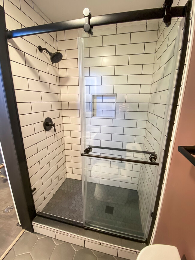 Custom tile shower in mid-level bathroom - 1606 S Lake Irving Dr SW