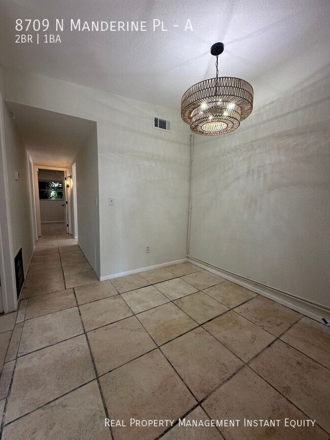 Building Photo - 8709 N Mandarine Pl