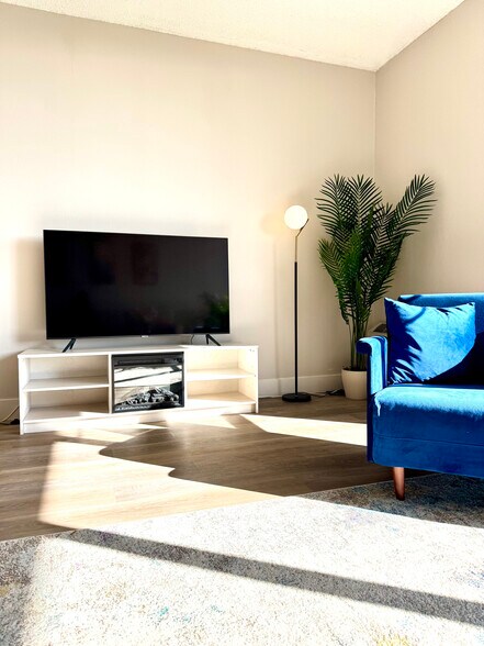Electric fireplace + arm chair that folds into twin guest bed - 633 Cowper St