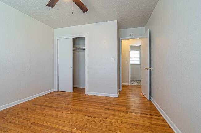 Building Photo - Three Bedroom Home in tree filled neighborhood! Lawn care included!