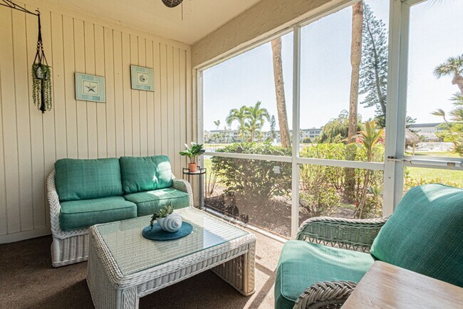 Building Photo - AVAILABLE NOW! Furnished Ground-Floor End Unit | Lake & Pool Views | Minutes to Marco Island & Do...