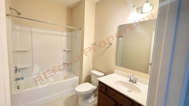 Building Photo - 3 Story Townhome 3 Bedrooms Rear Entry 2 Car Attached Garage with 1st Floor Bedroom, Community Po...